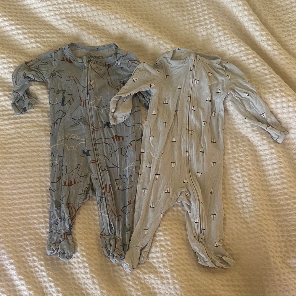 Two Carter's Blue footed one pieces: Dino and boats